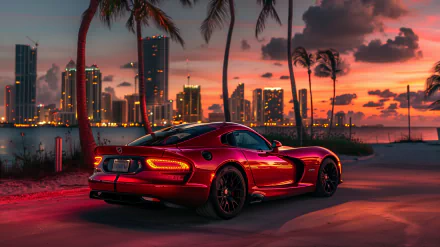 A sleek red Dodge Viper GTS parked along a palm-lined shore, with a stunning sunset and city skyline in the background, creating a vibrant HD desktop wallpaper.
