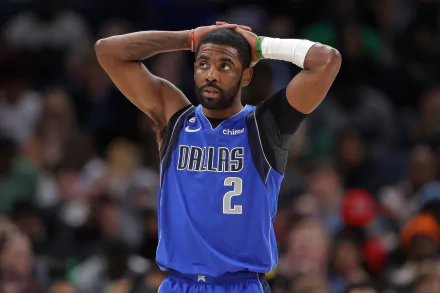 A professional basketball player wearing a Dallas Mavericks jersey with the number 2, standing on the court with his hands on his head in a HD desktop wallpaper.