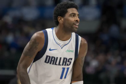 HD wallpaper featuring a basketball player in a Dallas Mavericks jersey, number 11, on the court during a game.
