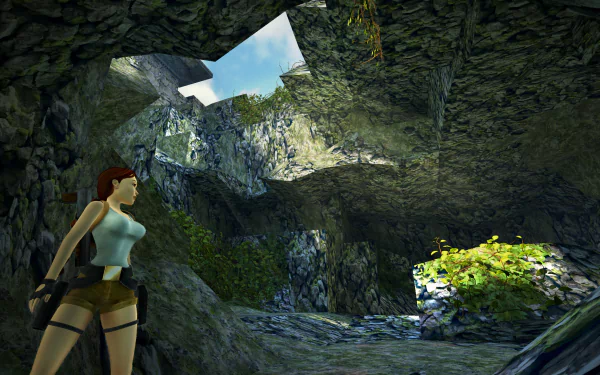 HD desktop wallpaper showcasing Lara Croft in an adventurous setting from Tomb Raider I-III Remastered, featuring a cave illuminated by natural light and lush greenery.