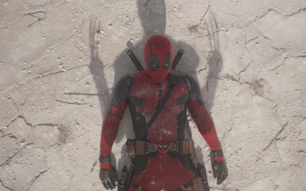 A high-definition desktop wallpaper featuring Deadpool lying on the ground, with a shadow of Wolverine’s claws prominently displayed behind him.