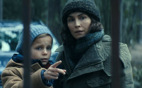 HD wallpaper featuring two characters from the TV Show Constellation, with a woman pointing into the distance as a child looks on, set in a wintery forest backdrop.
