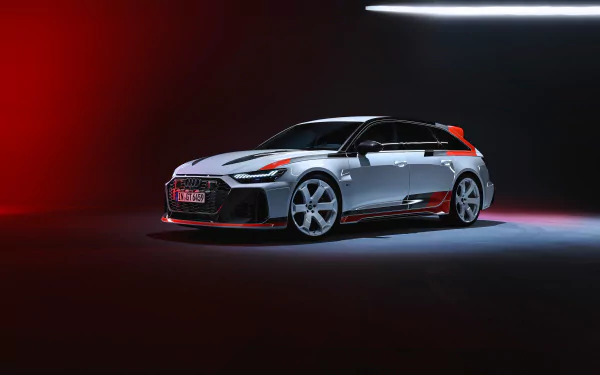 A sleek Audi RS6 Avant GT showcased against a dramatic dark background with vibrant lighting, making for a striking HD desktop wallpaper and background.