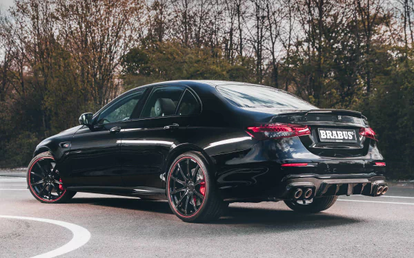 HD wallpaper of a black Brabus 800 E63 car parked on a road, showcasing its sleek design and sporty stance.