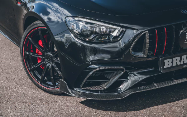 A Brabus 800 E63 black car, showcased as a high-definition desktop wallpaper with a focus on its front design.