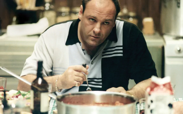HD wallpaper featuring a scene from the TV show The Sopranos with the main character cooking in the kitchen.
