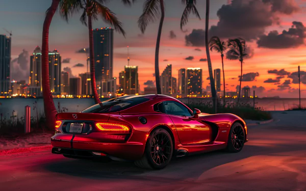 A sleek red Dodge Viper GTS parked along a palm-lined shore, with a stunning sunset and city skyline in the background, creating a vibrant HD desktop wallpaper.