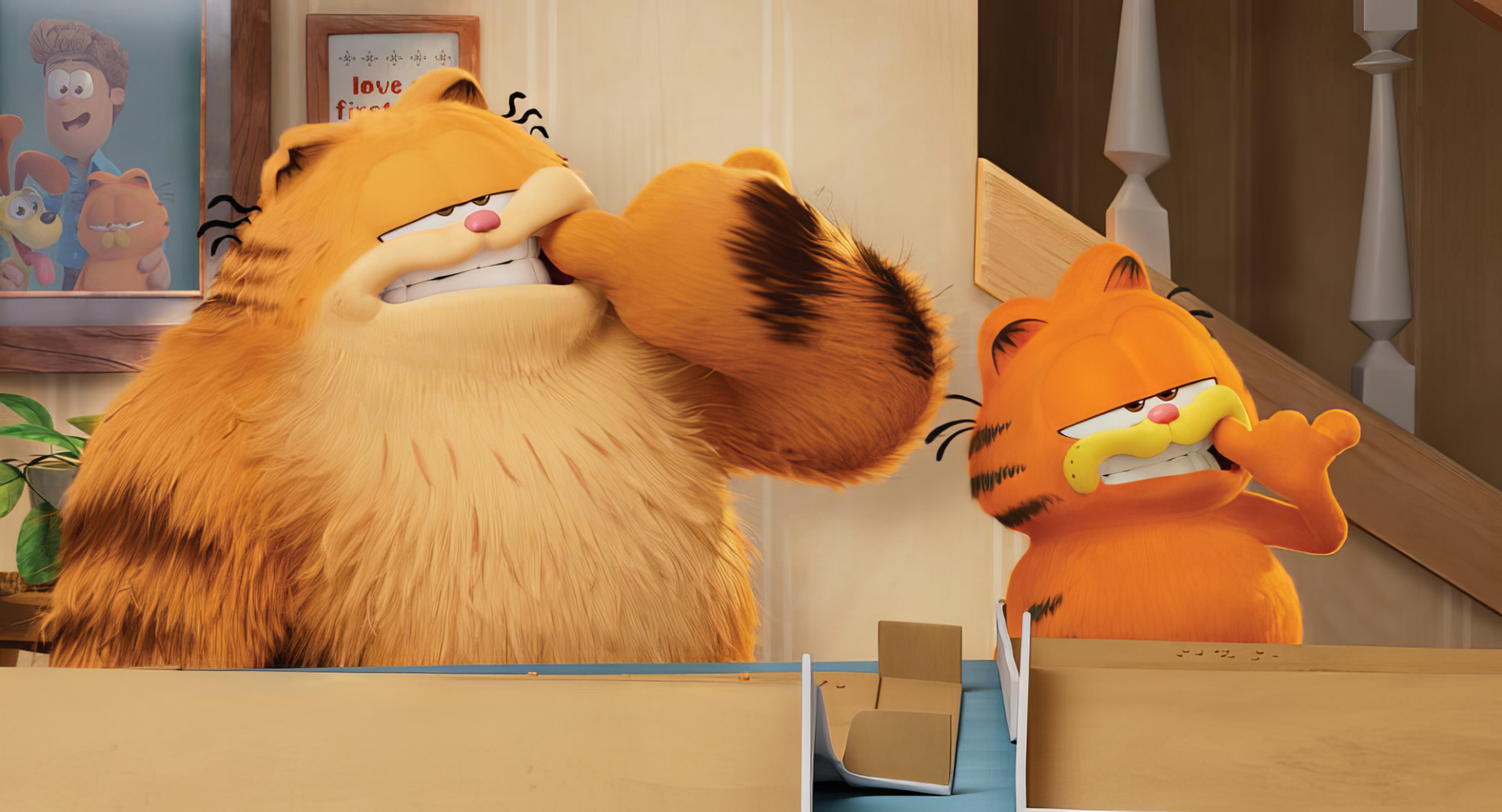 HD desktop wallpaper of Garfield from The Garfield Movie, showing two scenes of the animated, orange tabby cat reacting humorously inside a house.