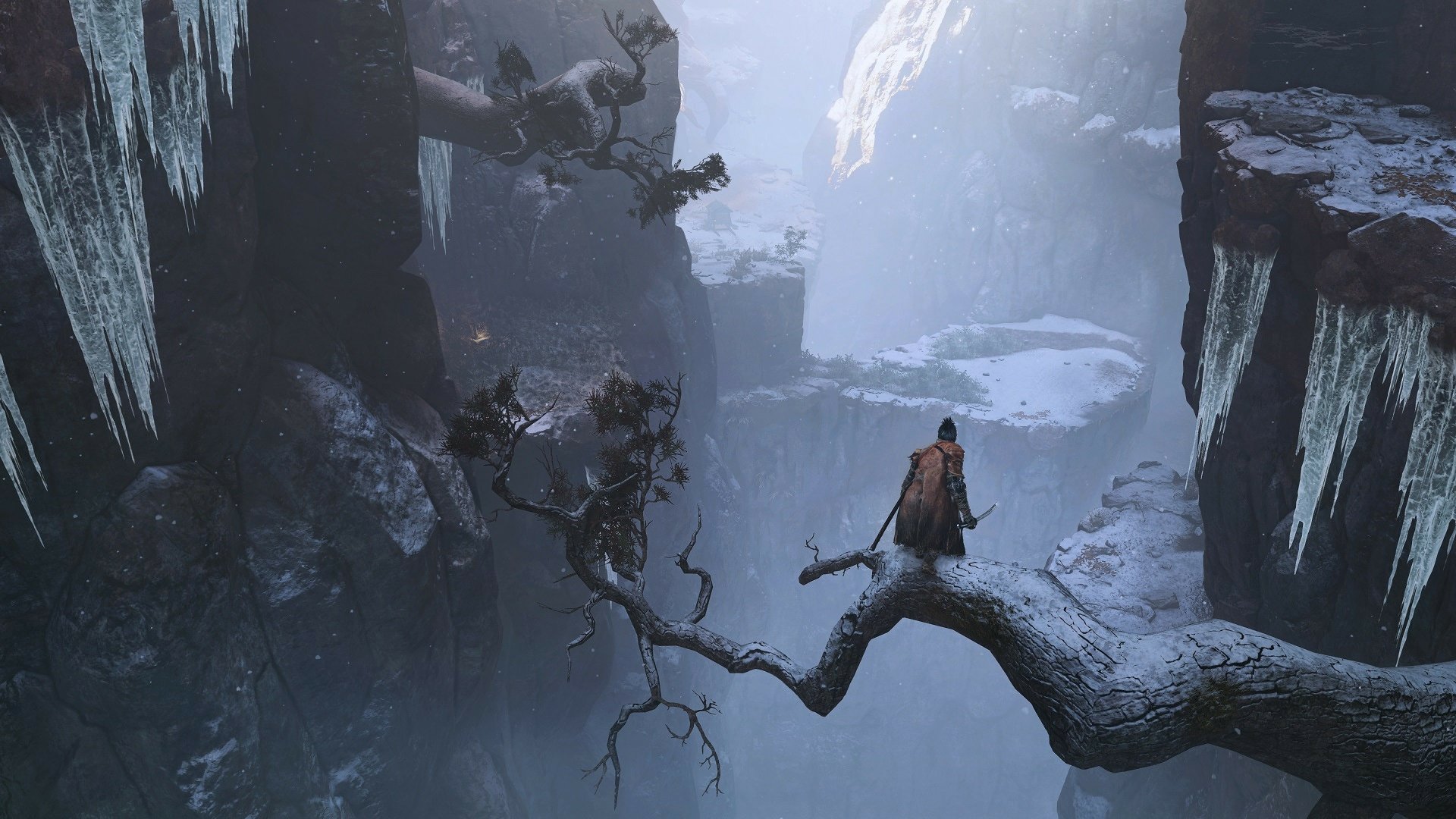 HD desktop wallpaper of Sekiro: Shadows Die Twice. A lone warrior stands on a snowy tree branch in a dark, icy canyon.