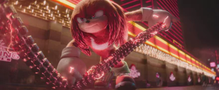HD wallpaper featuring Knuckles the Echidna, an animated character from the Sonic the Hedgehog series, showing a confident expression and preparing for action in a vividly lit environment.