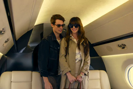 HD desktop wallpaper from the movie The Idea of You, depicting a young man and a woman in sunglasses, holding hands inside a private jet.