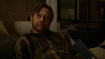 HD desktop wallpaper featuring Jimmi Simpson in a scene from the 2024 TV show Dark Matter, sitting on a couch with a contemplative expression.