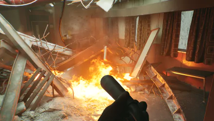 HD desktop wallpaper and background from the video game Still Wakes the Deep, depicting a first-person view in a fiery, debris-filled room.