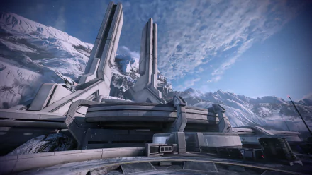HD desktop wallpaper of a futuristic structure set in a snowy mountainous landscape from Mass Effect Legendary Edition.