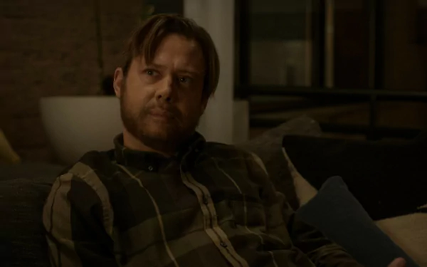 HD desktop wallpaper featuring Jimmi Simpson in a scene from the 2024 TV show Dark Matter, sitting on a couch with a contemplative expression.