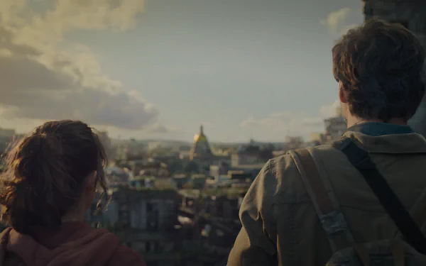 An 8K Ultra HD PC desktop wallpaper featuring two characters from The Last Of Us overlooking a cityscape under a cloudy sky.