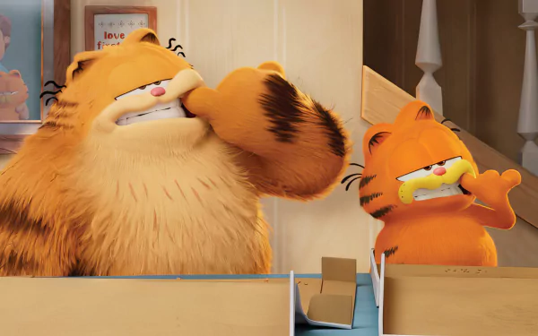 HD desktop wallpaper of Garfield from The Garfield Movie, showing two scenes of the animated, orange tabby cat reacting humorously inside a house.