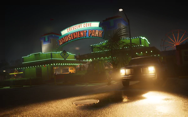 A HD desktop wallpaper featuring an eerie nighttime scene from the video game Killer Klowns from Outer Space: The Game, showing the Crescent Cove Amusement Park lit with neon lights and a car in the foreground.