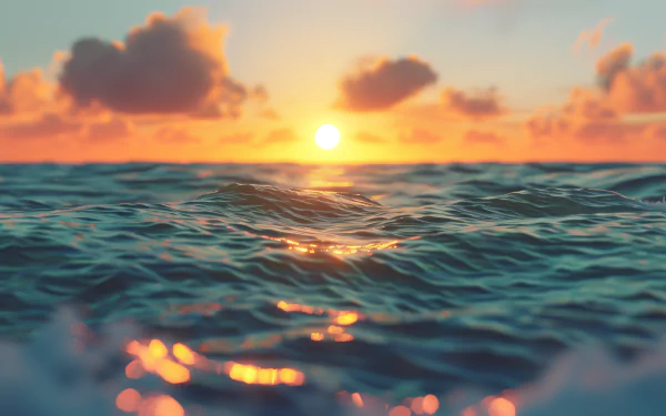 HD desktop wallpaper of an ocean sunset, featuring vibrant colors and gentle waves under a glowing sky with scattered clouds.