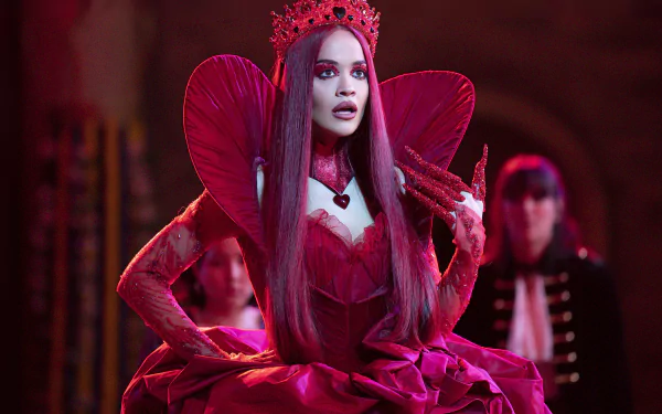 HD wallpaper and background from the movie Descendants: The Rise of Red, featuring a character dressed in an elaborate red costume with a crown.