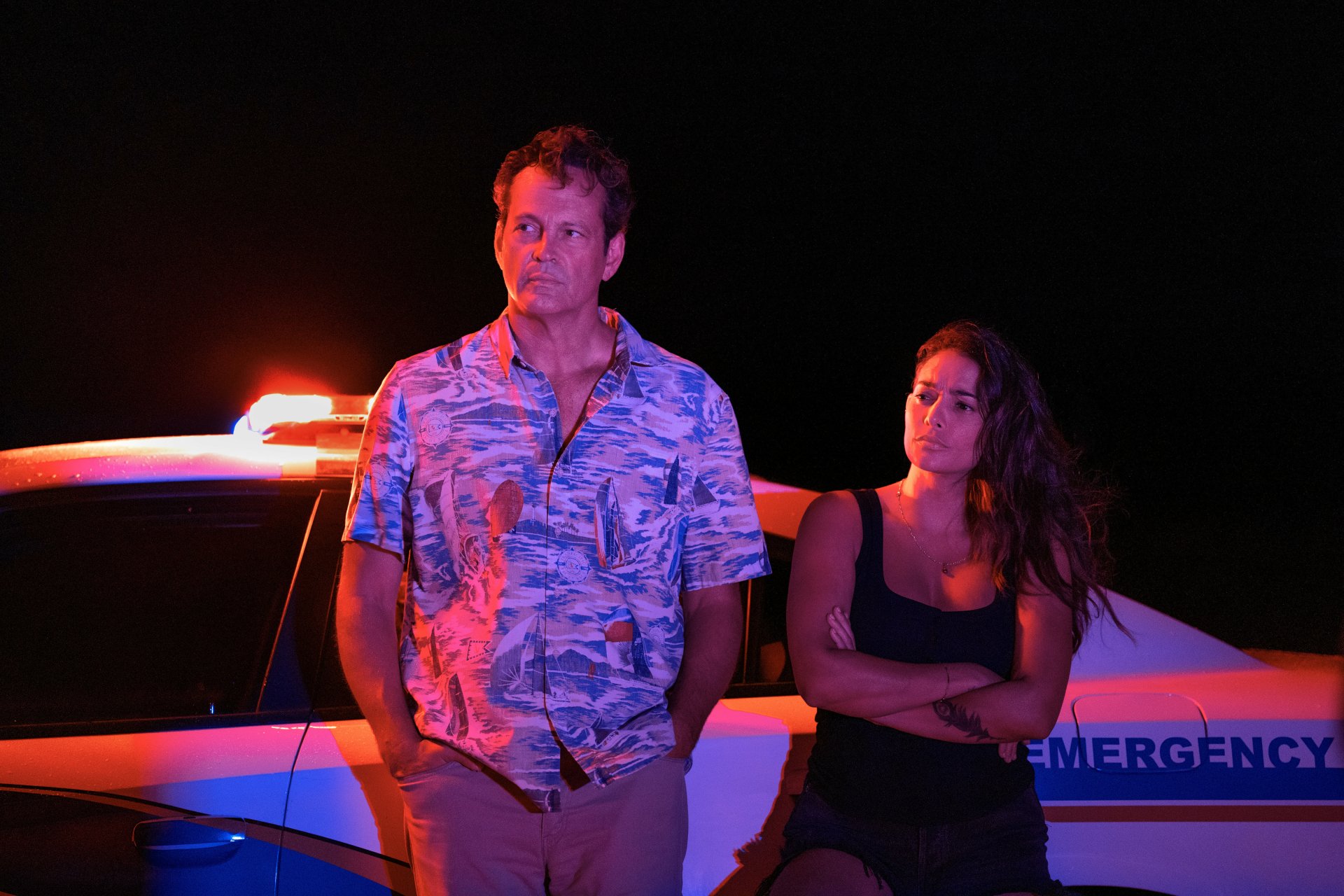 HD wallpaper featuring characters from the TV show Bad Monkey, starring Vince Vaughn and Natalie Martínez, set against a stylish, dark background.