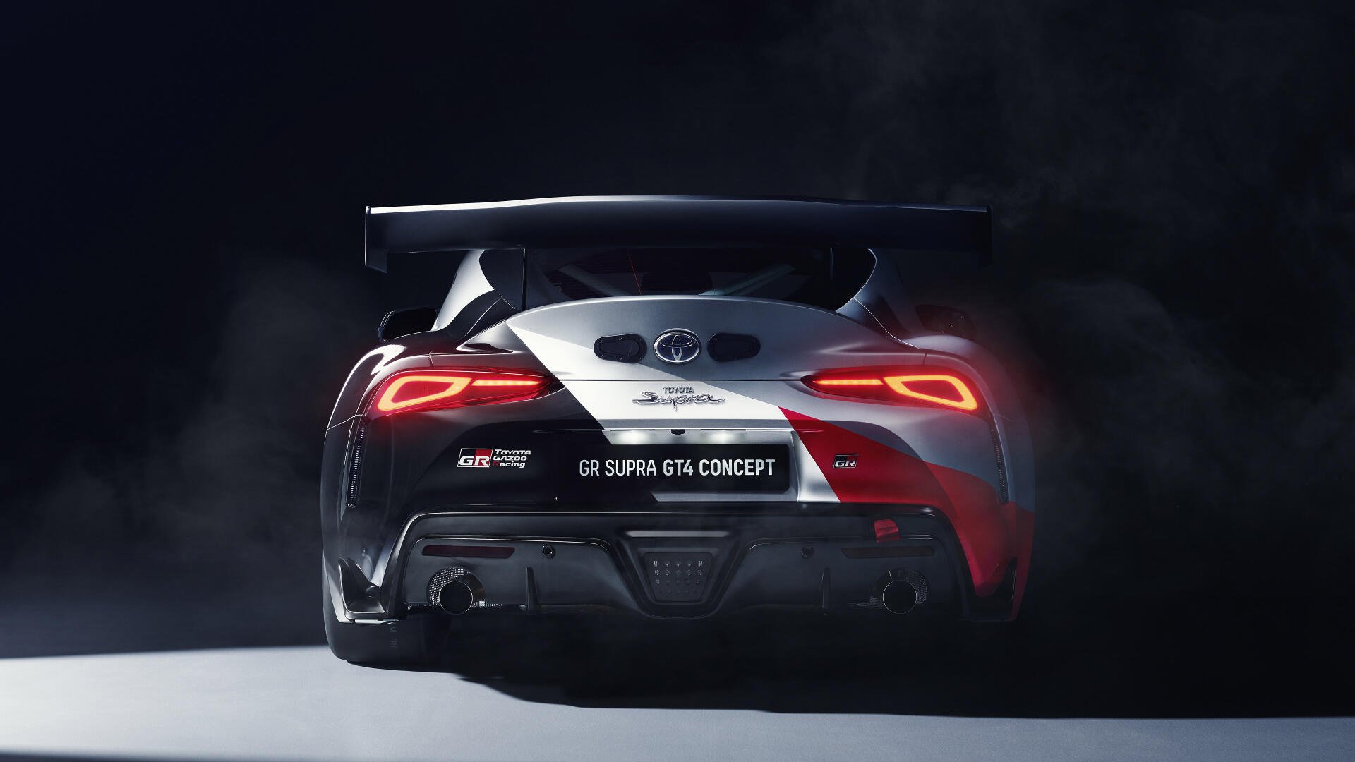 A sleek Toyota Supra GTS Concept in a dramatic backdrop, showcasing its distinctive rear design and bold features. This 4K Ultra HD image serves as a striking PC desktop wallpaper.