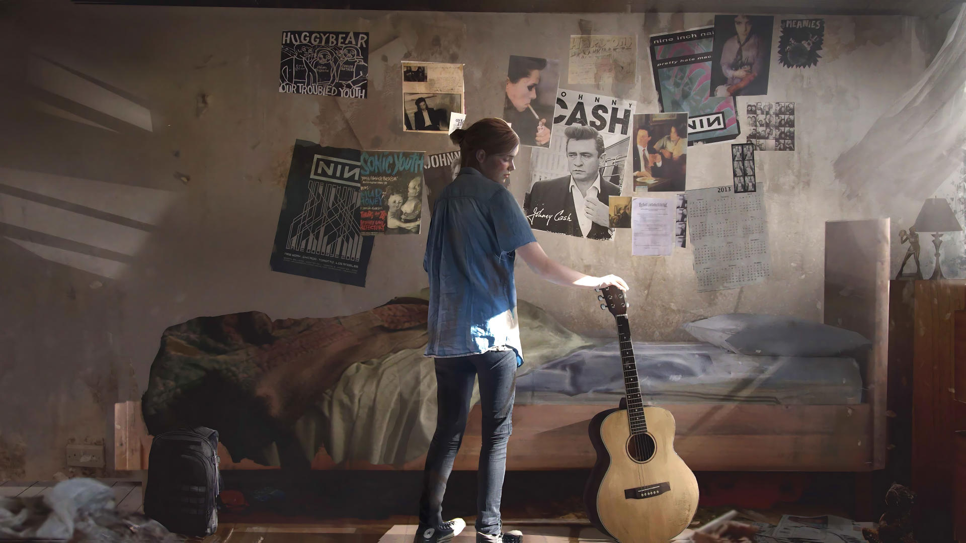 8K Ultra HD desktop wallpaper featuring a scene from The Last of Us, showing a character standing in a dimly lit room with a bed, guitar, and posters on the wall.