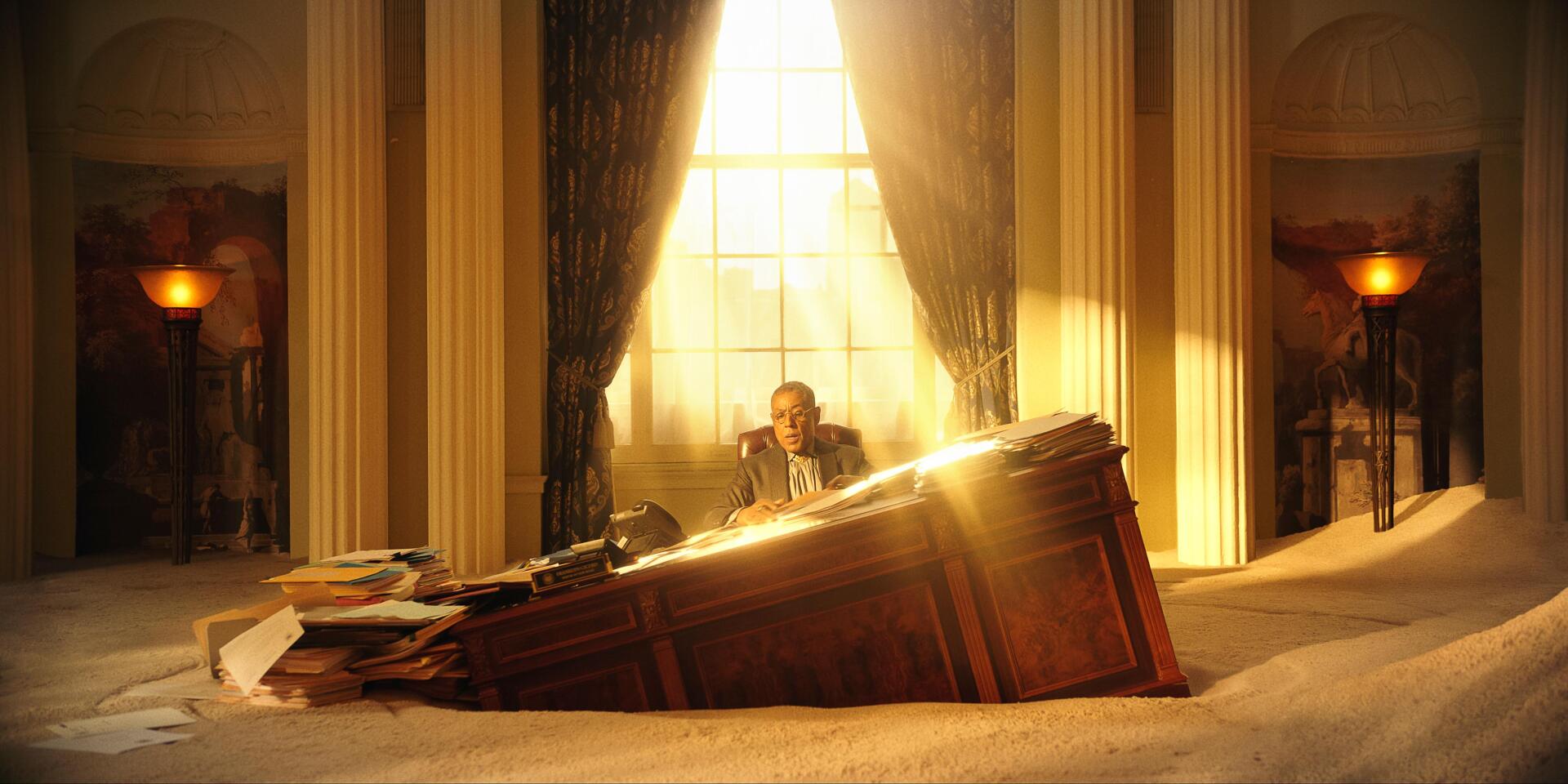 A dramatic scene from the movie *Megalopolis* (2024) featuring Giancarlo Esposito sitting at a desk, illuminated by sunlight streaming through large windows.