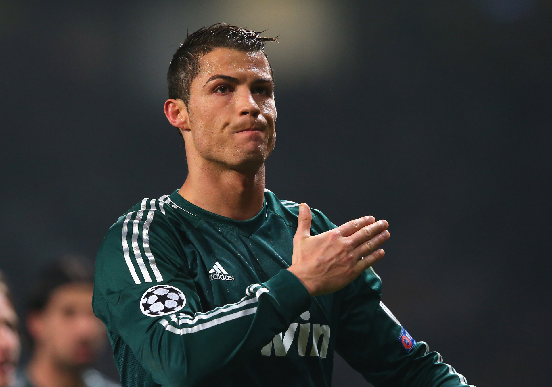 Cristiano Ronaldo, in a Real Madrid C.F. jersey, gestures during a match, captured in stunning 4K Ultra HD, showcasing his intensity and passion for soccer.