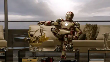 A high-definition desktop wallpaper featuring Iron Man lounging on a stylish sofa, with a dramatic sky in the background, capturing the essence of the superhero movie.