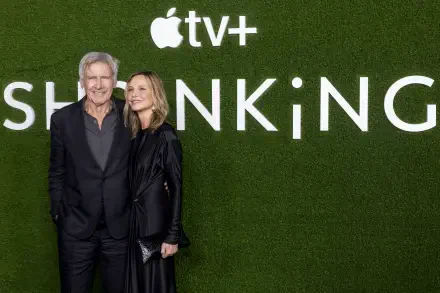 Harrison Ford and Calista Flockhart pose together in front of a green backdrop displaying the title SHRINKING for the Apple TV+ show, captured in a vibrant 4K Ultra HD image.