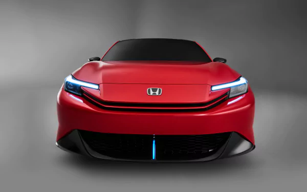 A striking red Honda Prelude showcased as a high-definition desktop wallpaper, highlighting its sleek design and modern vehicle aesthetics.