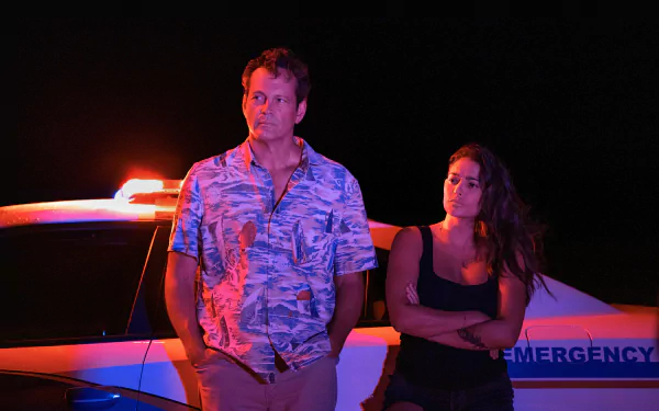 HD wallpaper featuring characters from the TV show Bad Monkey, starring Vince Vaughn and Natalie Martínez, set against a stylish, dark background.