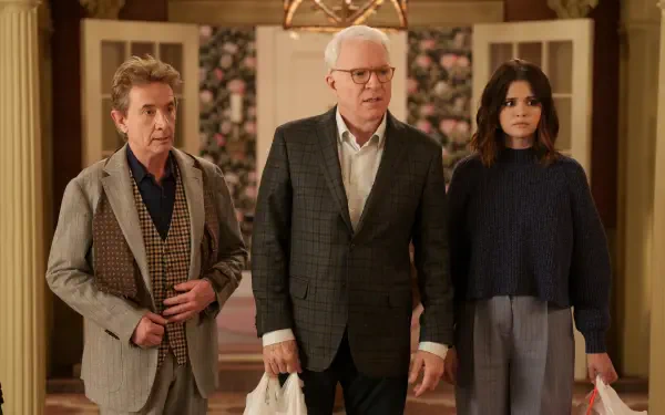 HD wallpaper featuring the cast of Only Murders in the Building, including Steve Martin, Martin Short, and Selena Gomez, set against a stylish backdrop.