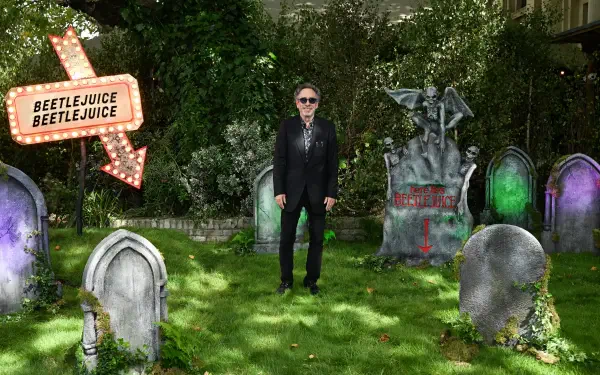 An 8K Ultra HD desktop wallpaper inspired by Tim Burton's Beetlejuice, capturing the movie's unique style and vivid imagery for fans and enthusiasts.