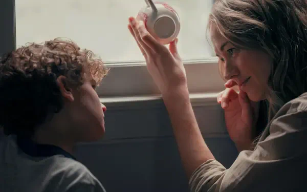 A touching moment between a woman and a child, discussing a teacup by the window, captured in stunning detail. From the TV show Teacup (2024), this 4K Ultra HD wallpaper highlights their bond.