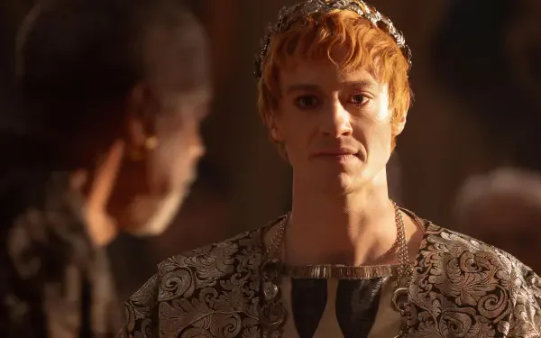 A detailed 4K Ultra HD wallpaper featuring Joseph Quinn in a scene from Gladiator II, showcasing his character's regal attire and presence in a dramatic moment.