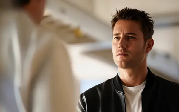Justin Hartley appears in a scene from the TV show Tracker (2024), featuring a contemplative expression in a stylish HD wallpaper setting.
