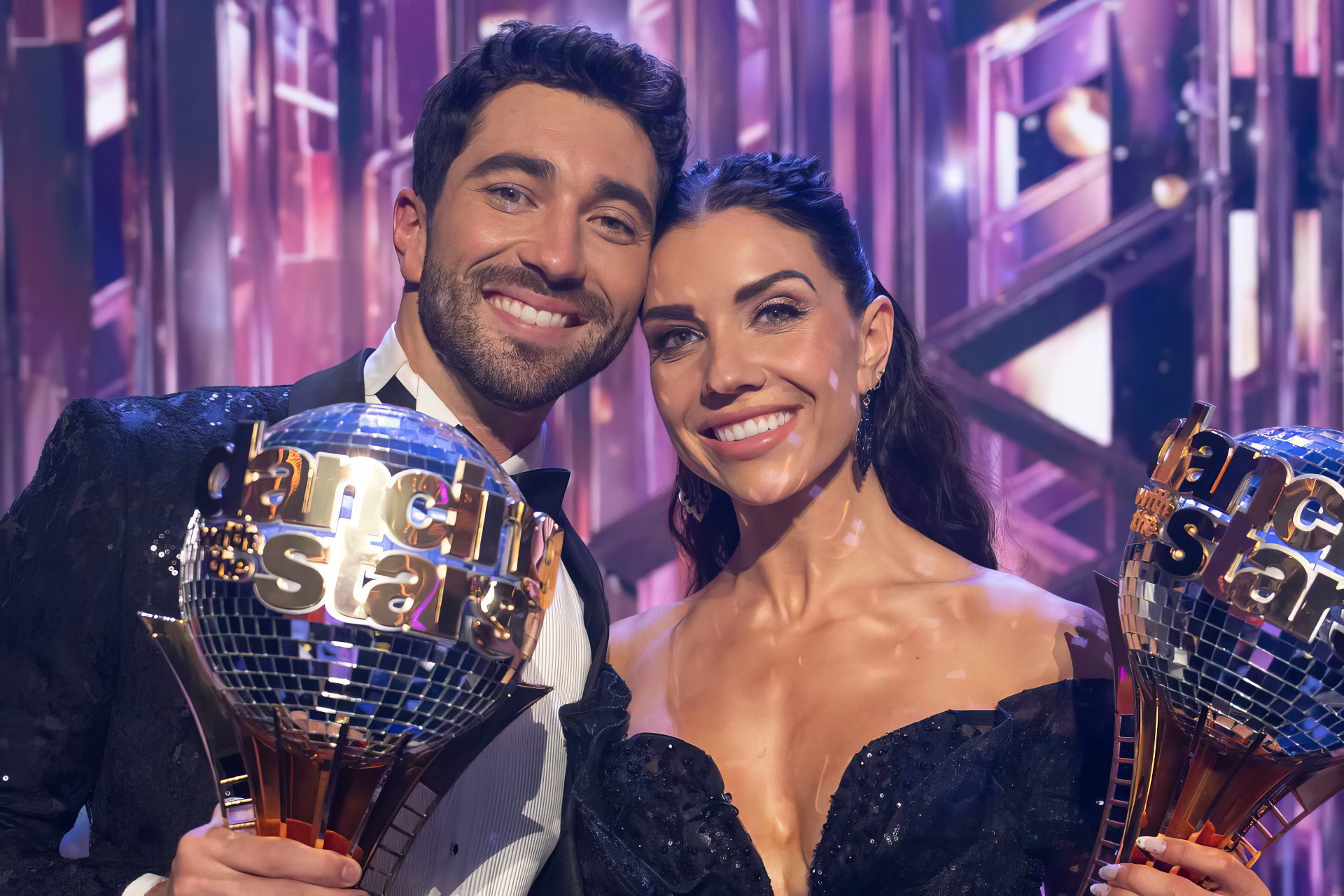 Joey Graziadei and his partner celebrate with their trophies on Dancing with the Stars, showcasing their success in an electrifying performance backdrop. HD wallpaper option available.