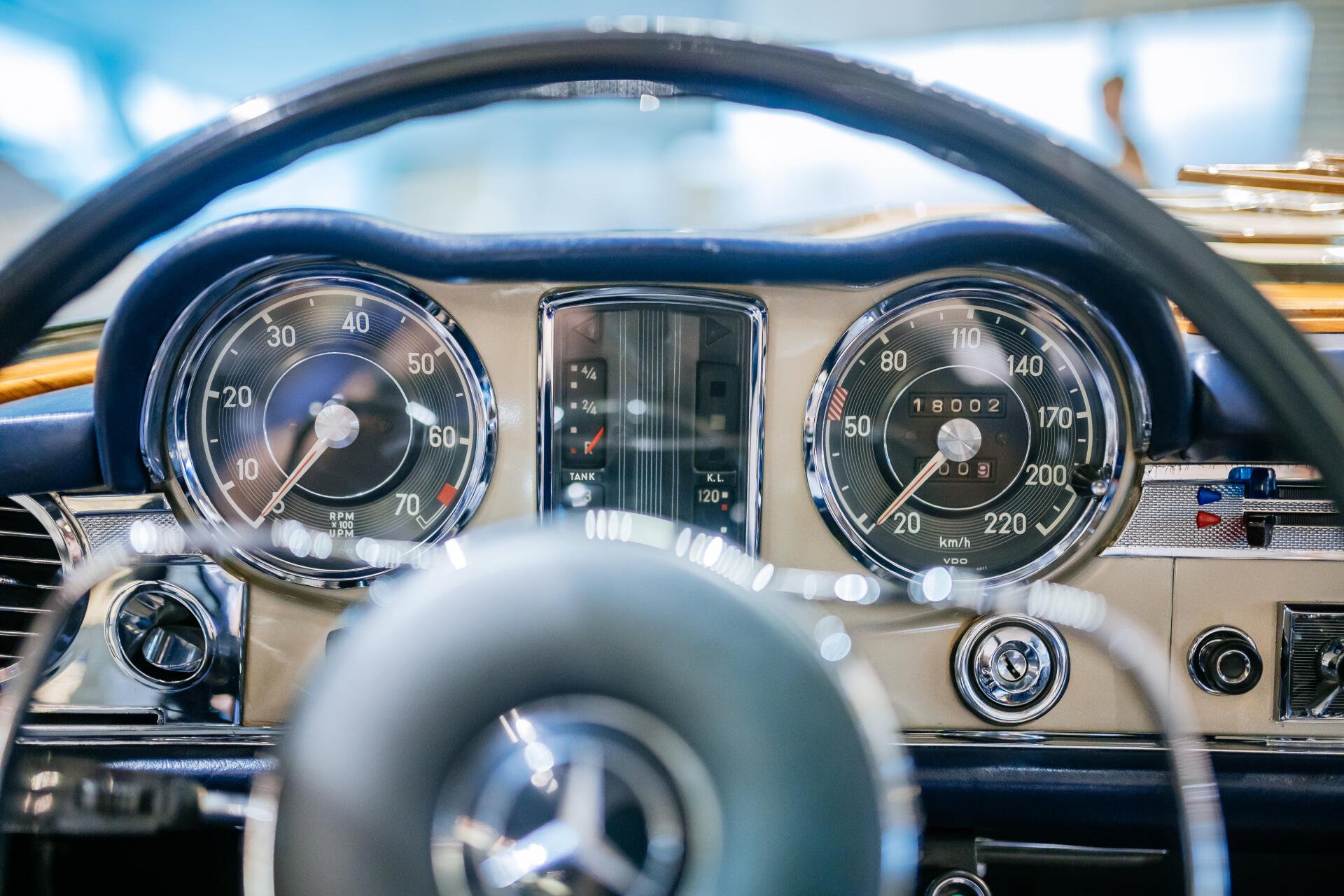 A detailed view of the speedometer in a Mercedes-Benz 230 SL, showcasing classic design elements. This image serves as a stunning 4K Ultra HD wallpaper for automotive enthusiasts.