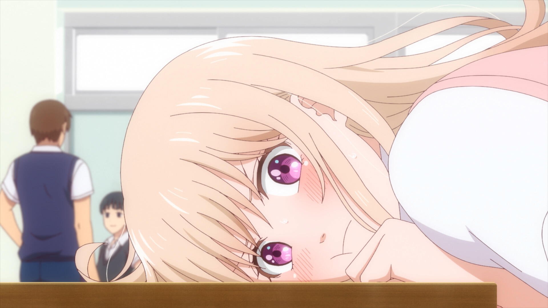 A character from Medaka Kuroiwa Is Impervious to My Charms rests her head on a desk, displaying large, expressive pink eyes, in a vibrant classroom setting. HD desktop wallpaper.