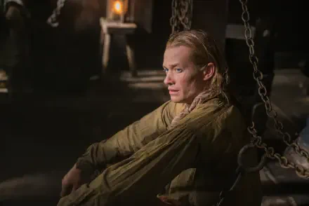 Ed Speleers portrays a contemplative character in this dramatic scene from the TV show Outlander, captured in stunning 4K Ultra HD detail and ambiance.