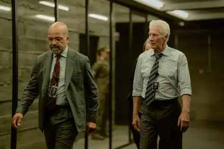 A scene from the TV show The Agency, featuring Richard Gere and Jeffrey Wright walking through a modern hallway, captured in stunning 8K Ultra HD.