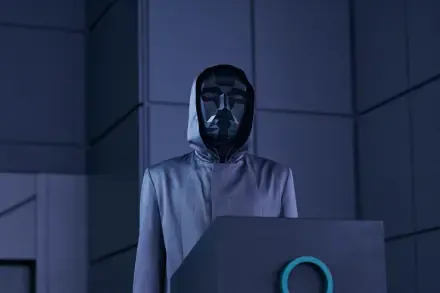 A striking HD wallpaper from the TV show Squid Game, featuring a mysterious figure in a hooded robe and a geometric backdrop, capturing the show's intense atmosphere.