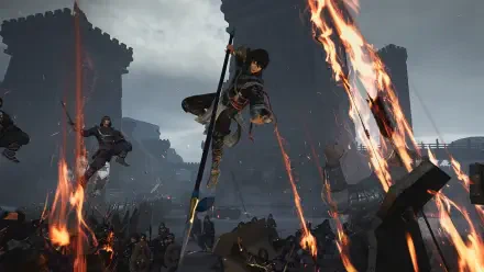 An action-packed scene from the video game Dynasty Warriors: Origins, featuring a character leaping through a battlefield engulfed in flames, set against a dramatic backdrop.
