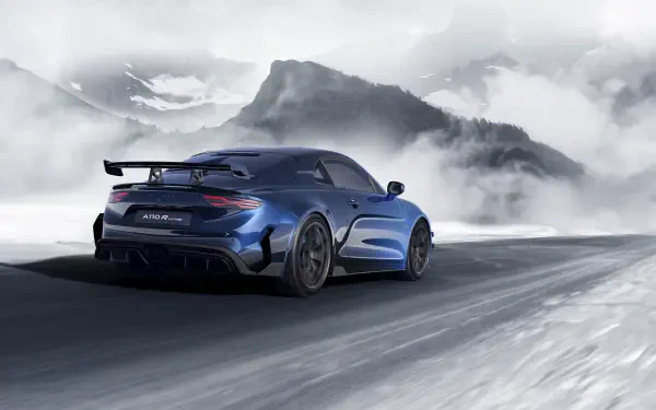 A stunning 8K Ultra HD image showcasing the Alpine A110 R Ultime, set against a dramatic mountain backdrop with snow, highlighting its sleek design and performance-ready features.
