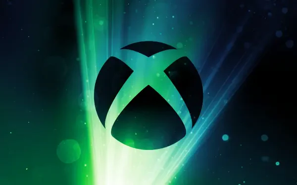 A vibrant HD PC desktop wallpaper featuring the Xbox logo against a backdrop of green and blue light rays, capturing the essence of video gaming.