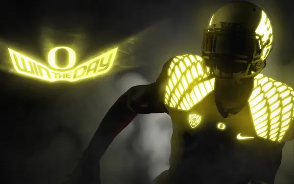 An Oregon Ducks football player in a striking yellow uniform stands against a dark background, embodying the spirit of competition with the slogan Win the Day. High-definition desktop wallpaper.