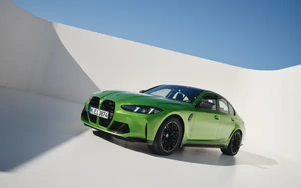 A vibrant green BMW M3 showcased in a sleek setting, captured in stunning 4K Ultra HD, perfect for a stylish PC desktop wallpaper and background.