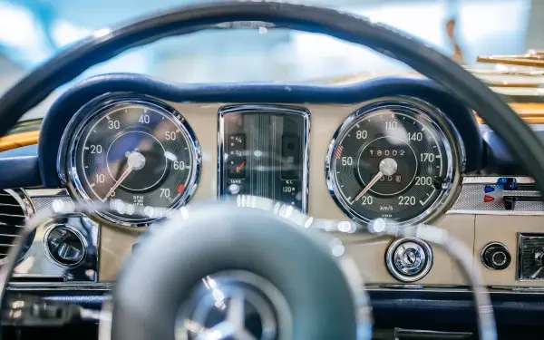A detailed view of the speedometer in a Mercedes-Benz 230 SL, showcasing classic design elements. This image serves as a stunning 4K Ultra HD wallpaper for automotive enthusiasts.